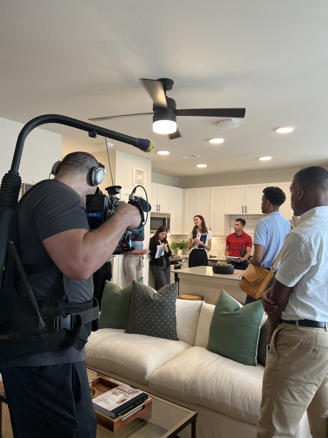 Dogtown Films operator filming a one-man-band shoot in a living room
