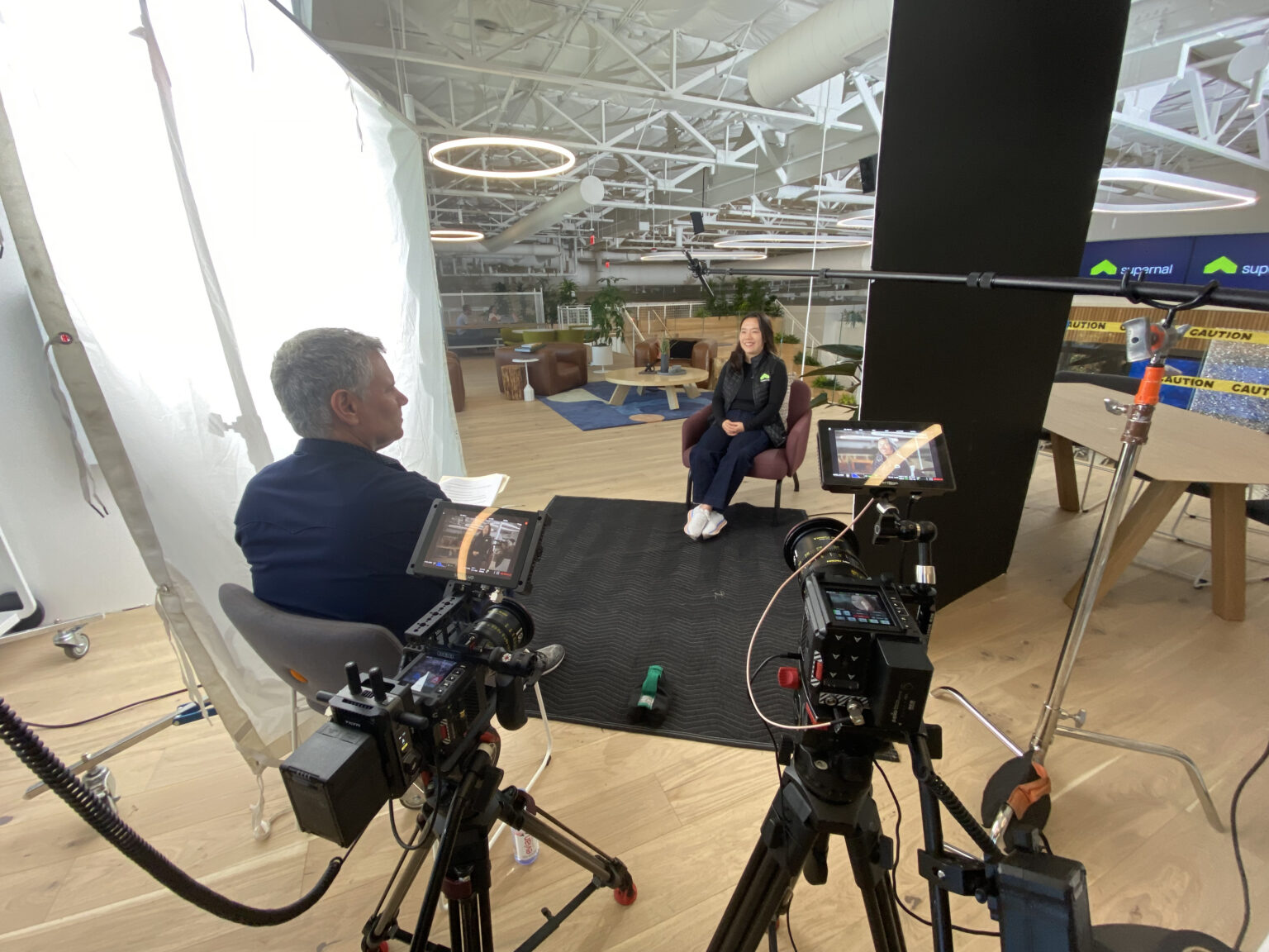 Two-camera interview setup in an open office