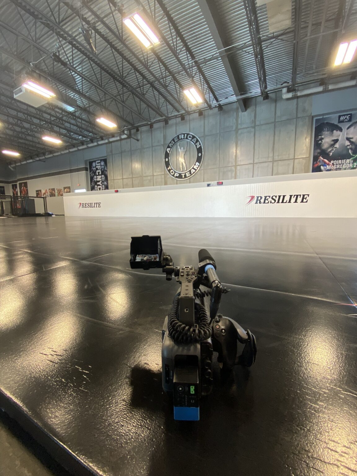 Camera set on the floor of an empty sports facility