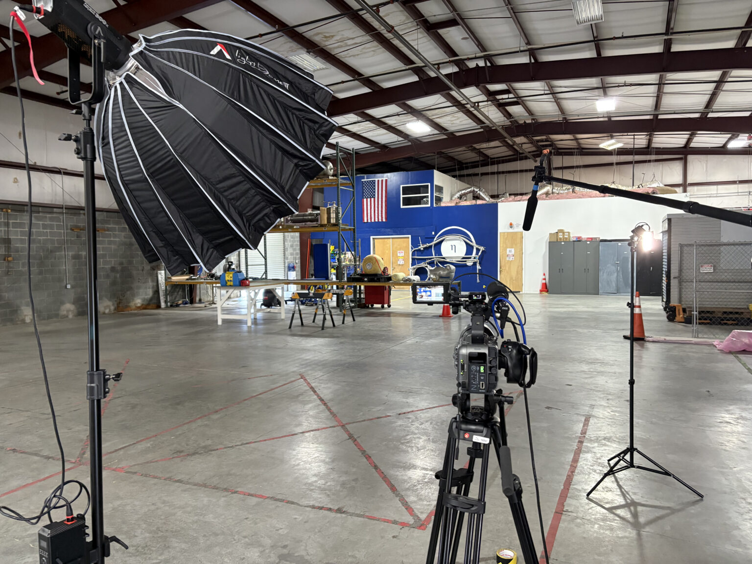 Lit camera setup inside an aviation hangar in Florida